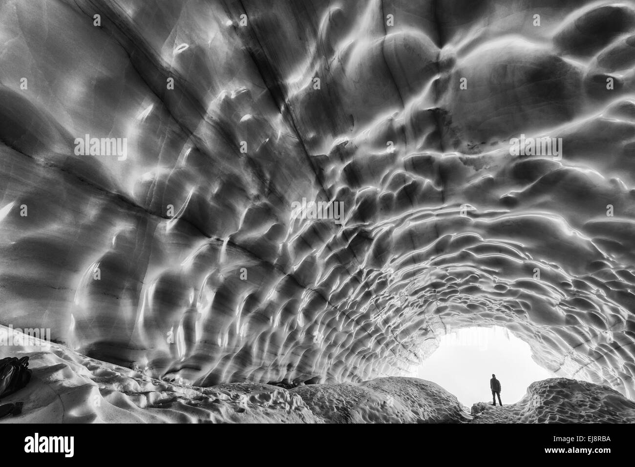 man inside a glacier, Kebnekaise mountains, Sweden Stock Photo