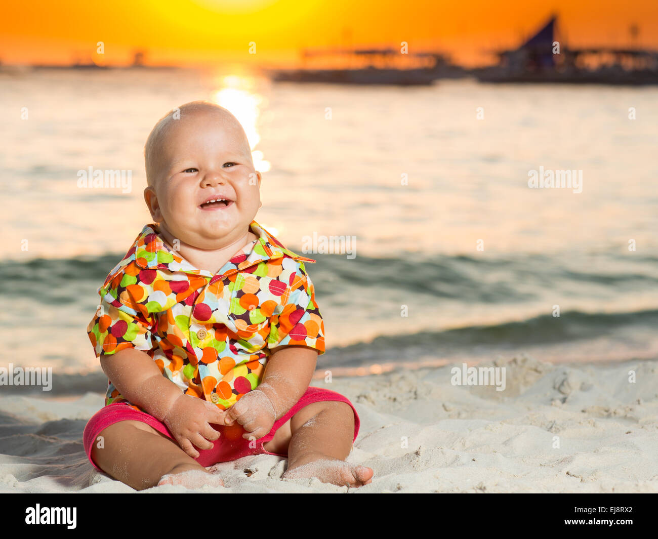 Baby on the beach Stock Photo