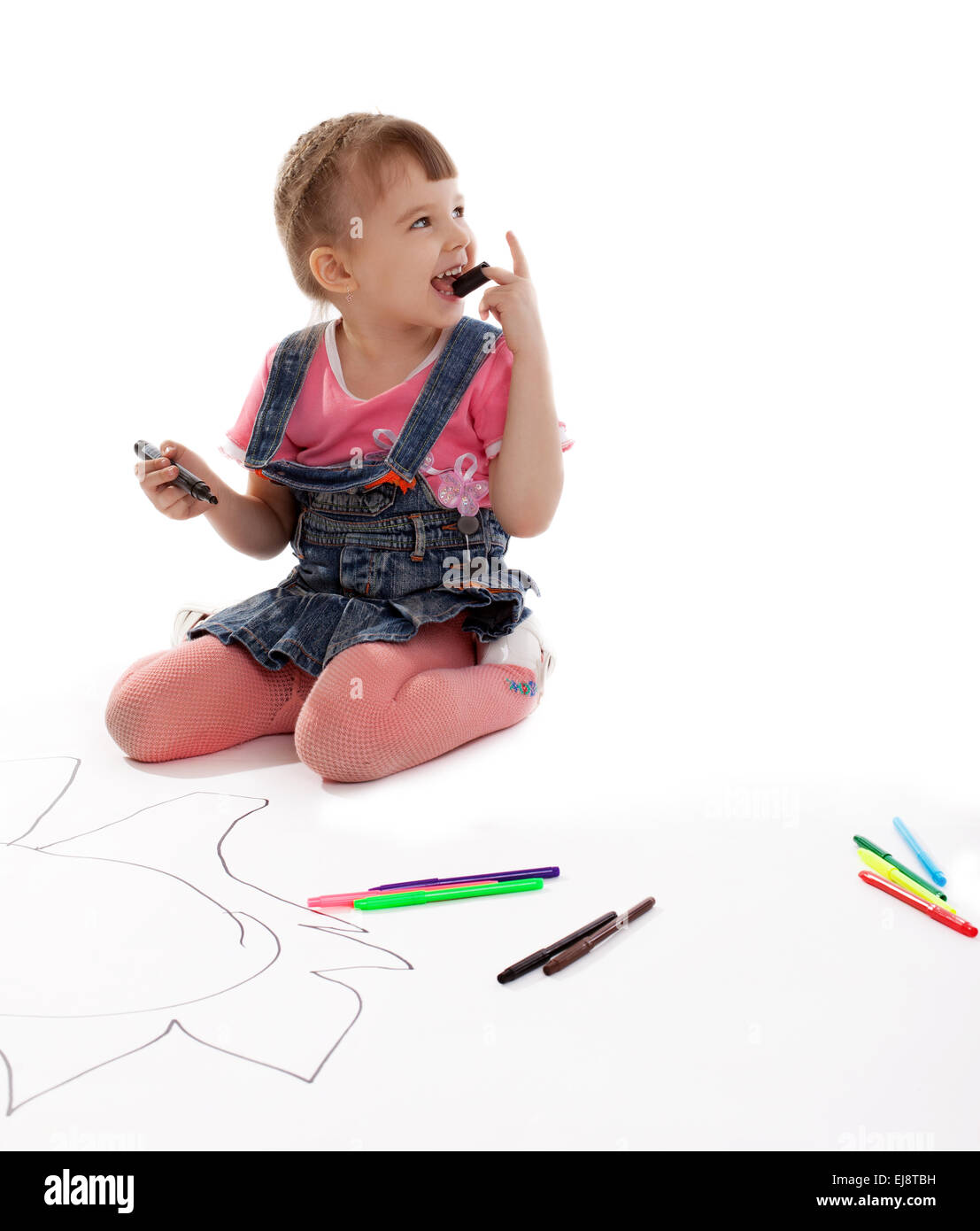 Happy girl drawing markers on floor Stock Photo Alamy