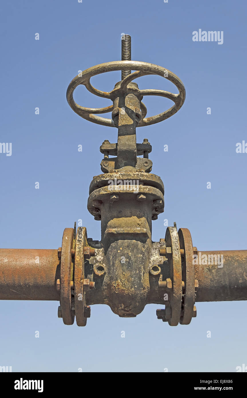Old pipe with large valve Stock Photo Alamy