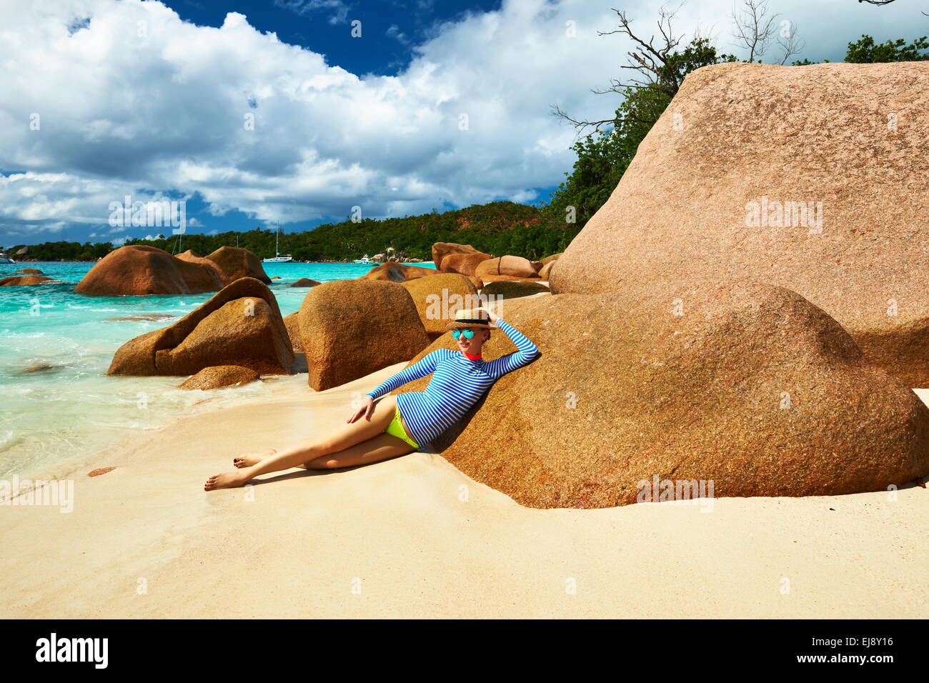 Woman at beautiful beach wearing rash guard Stock Photo Alamy