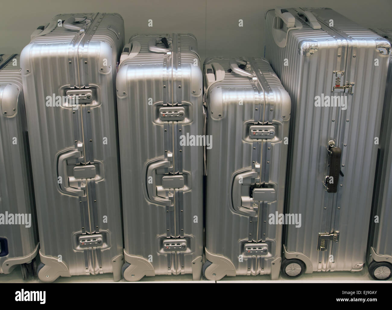Silver suitcases of different size Stock Photo Alamy