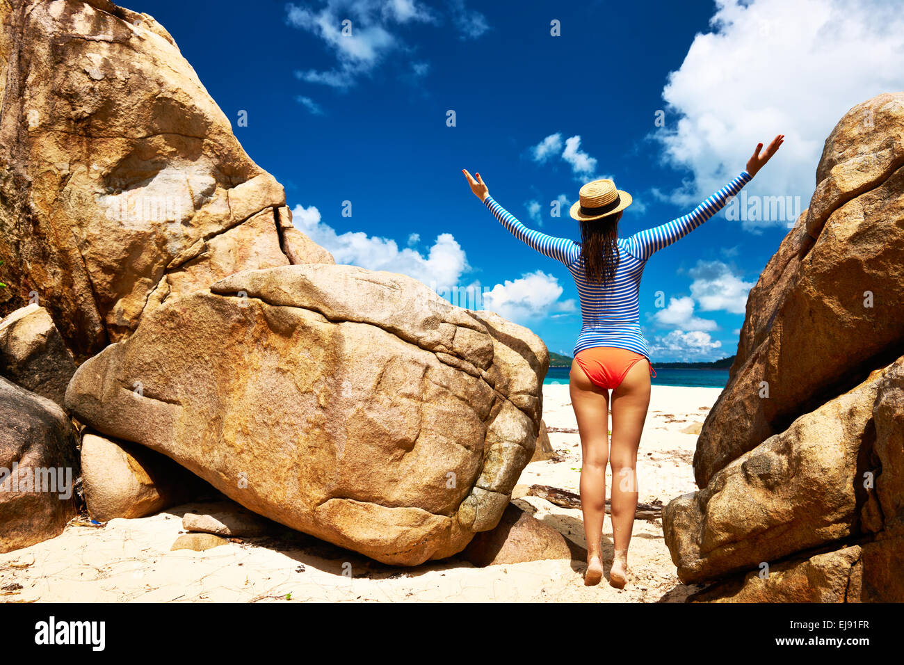 Woman at beautiful beach wearing rash guard Stock Photo Alamy