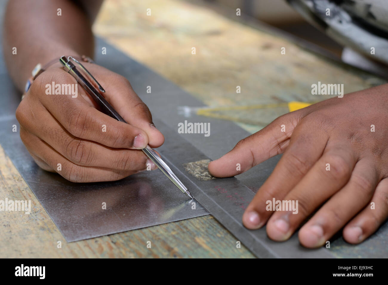 Skilled workers working with scriber Stock Photo
