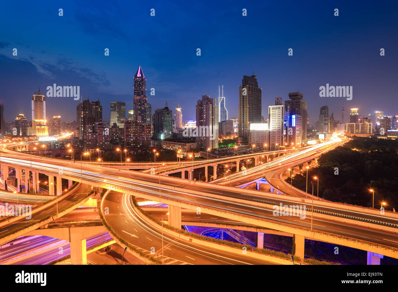 city highway traffic in nightfall Stock Photo