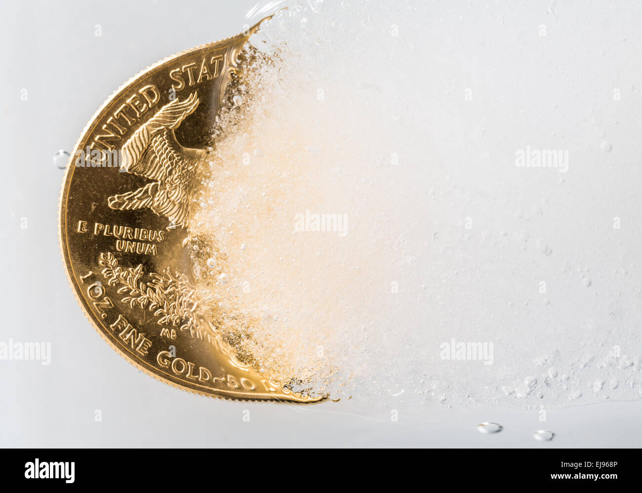 Golden Eagle coin emerging from deep freeze Stock Photo