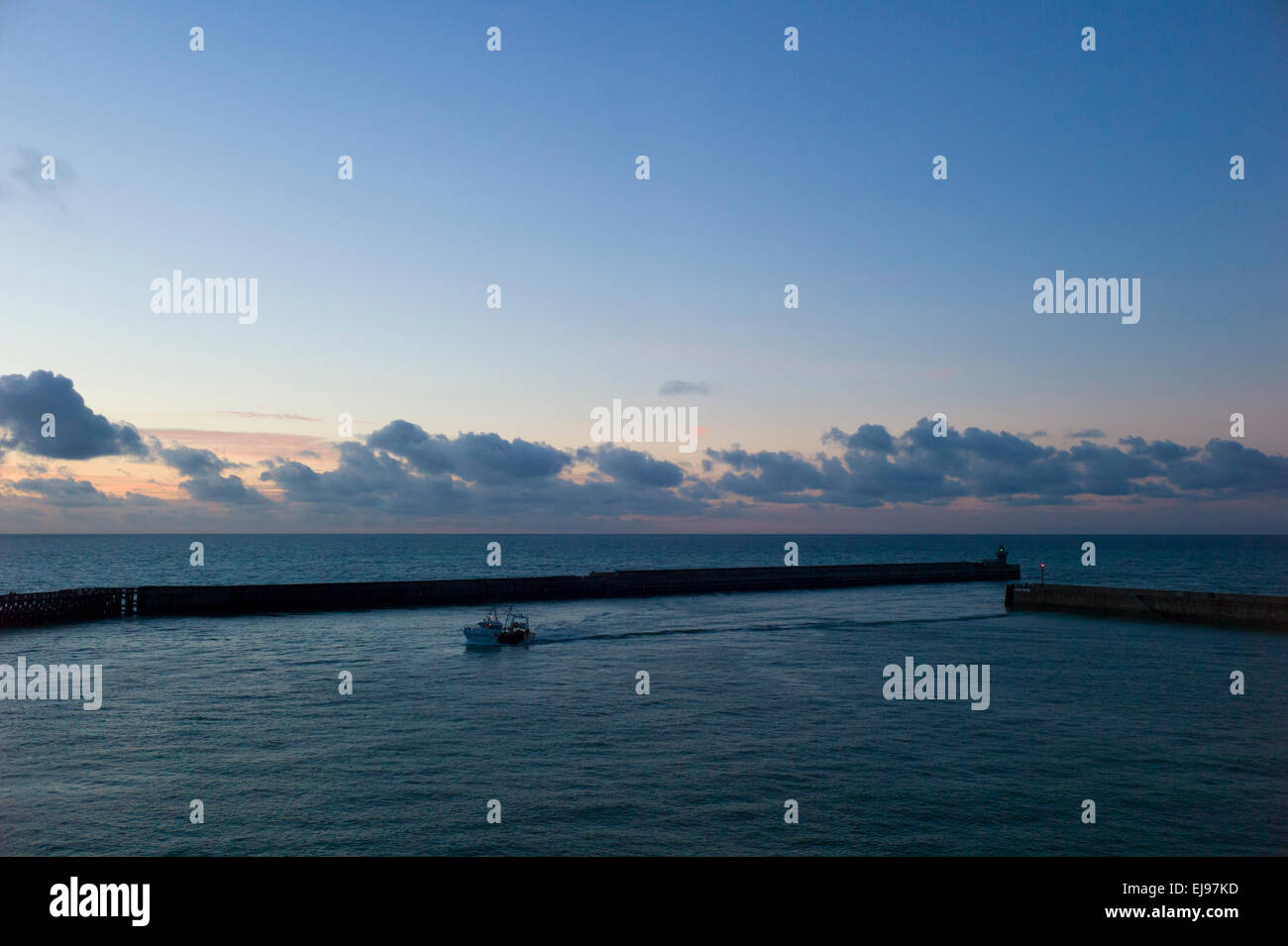 Fishing boat entering Dieppe harbour, Normandy,France,evening. Stock Photo