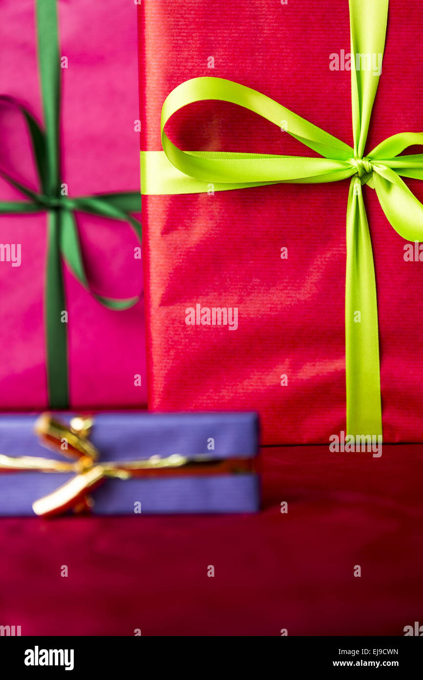 Green bowknots on red gift wrapping Stock Photo