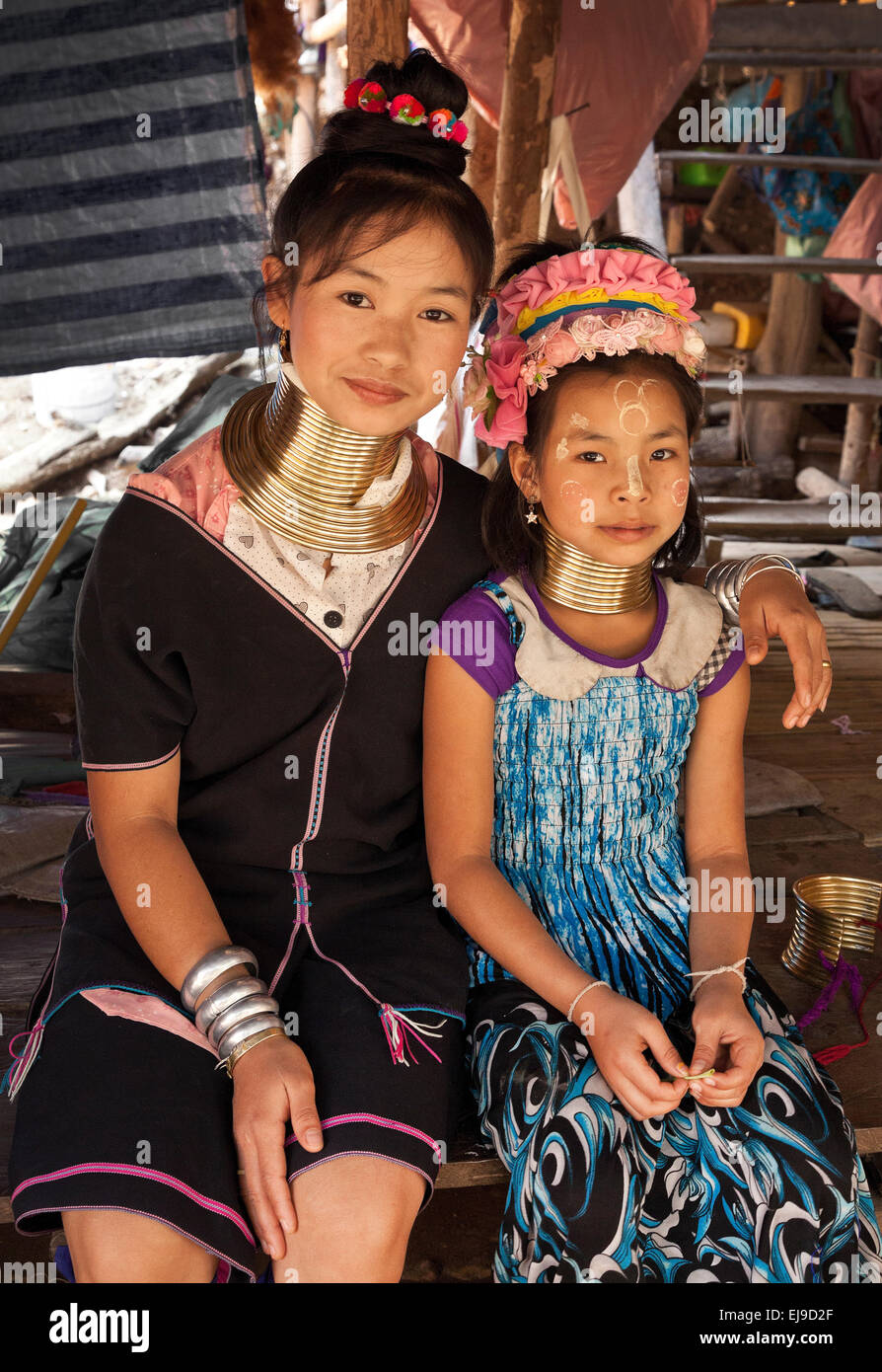 Young women from the Kayan Padaung hill tribe, Myanmar, Burma. wearing the traditional brass neck rings. Stock Photo