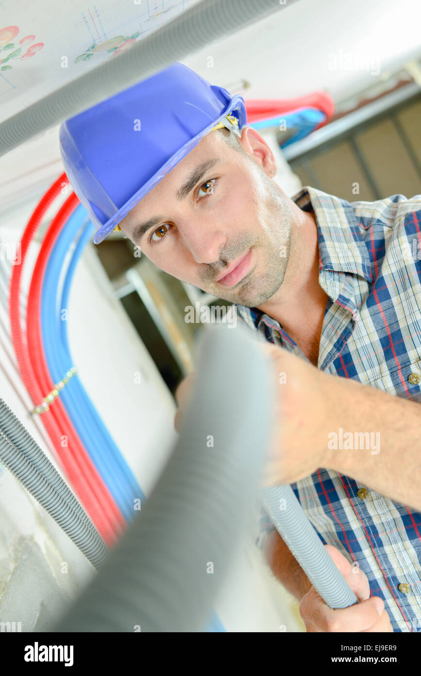 Electrician wiring a new house Stock Photo Alamy