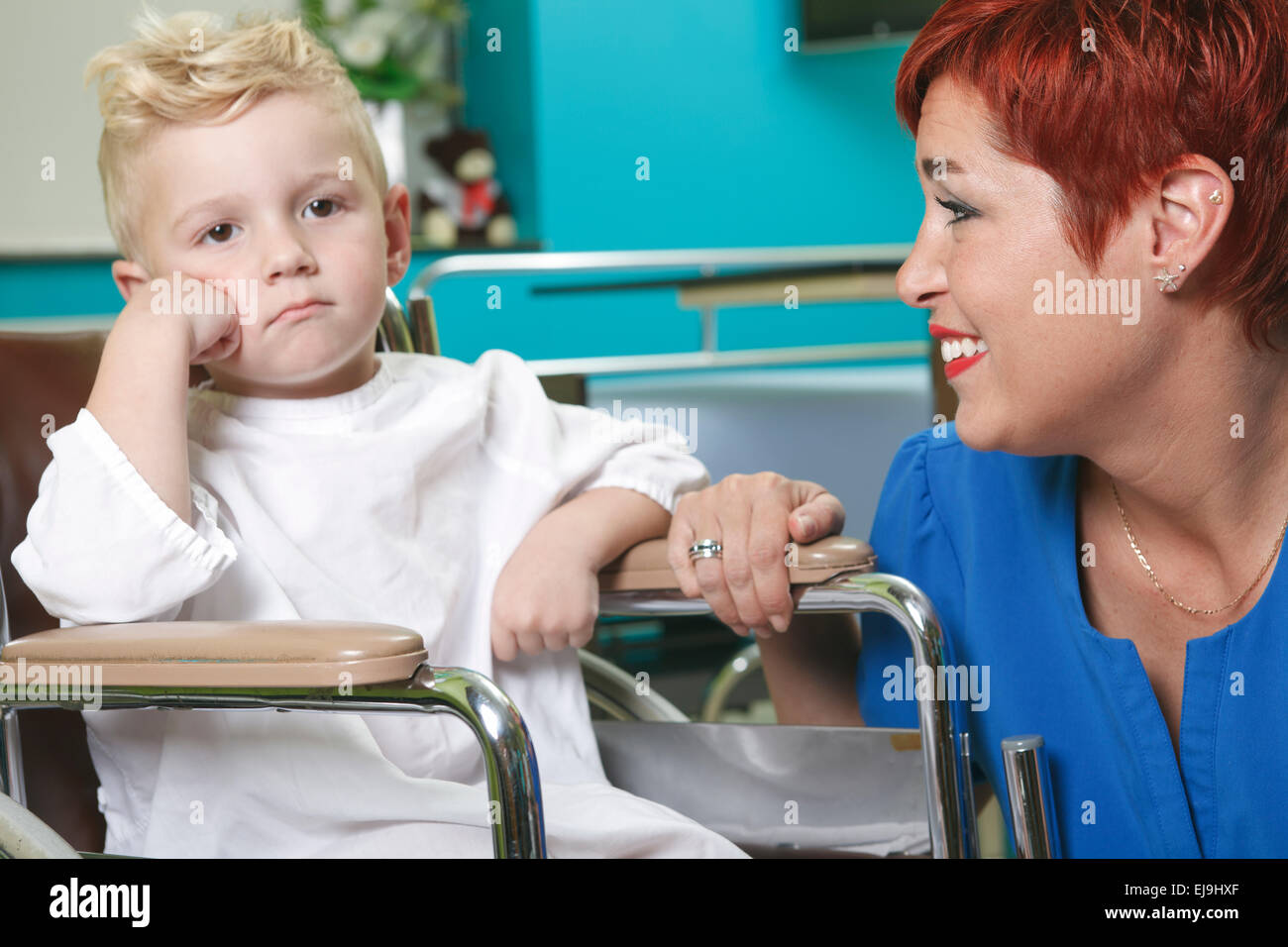 adorable little boy in the wheelchair Stock Photo - Alamy