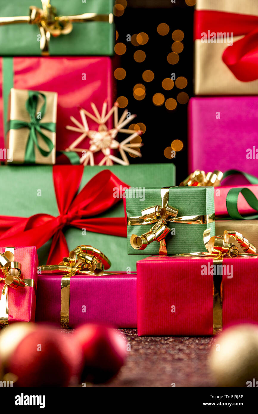 Twinkles Between Towering Xmas Gifts Stock Photo