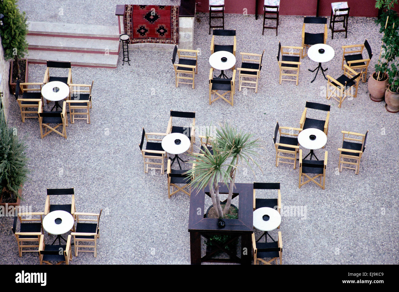 View over an Empty Restaurant with Empty Tables and Chairs Rhodes Old Town Rhodes Greece Stock Photo