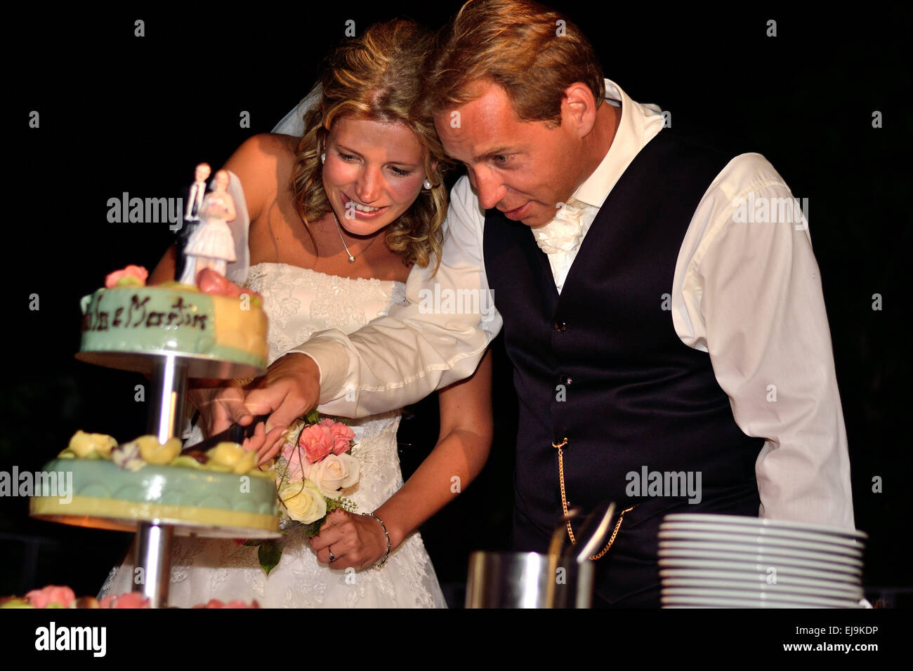 Bridal Couple with Wedding Cake Stock Photo