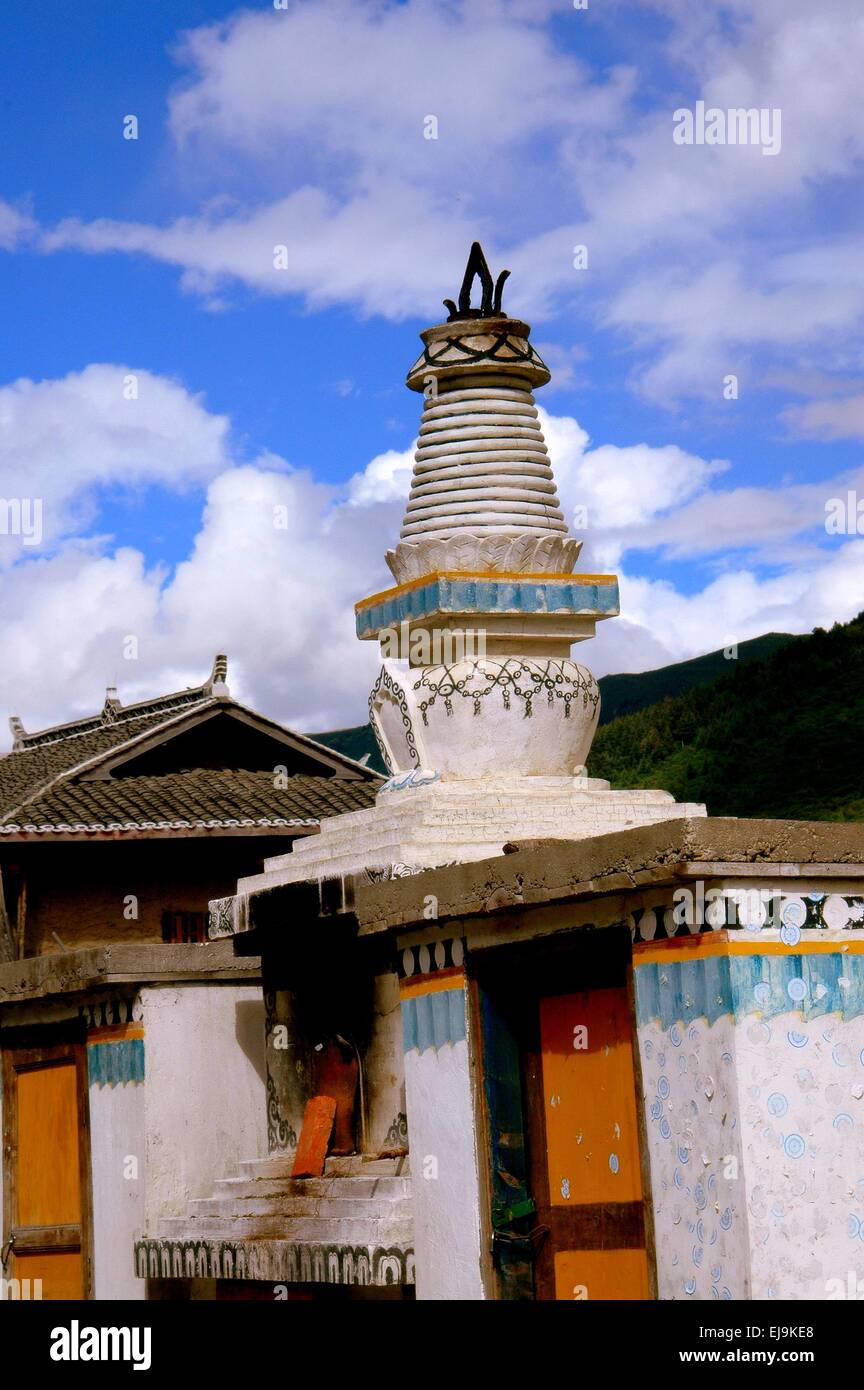 Gamel, China:  A white ornateringed Dagoba sits above a funery oven at the Gamel Chador Gonchen Tibetan Temple Stock Photo