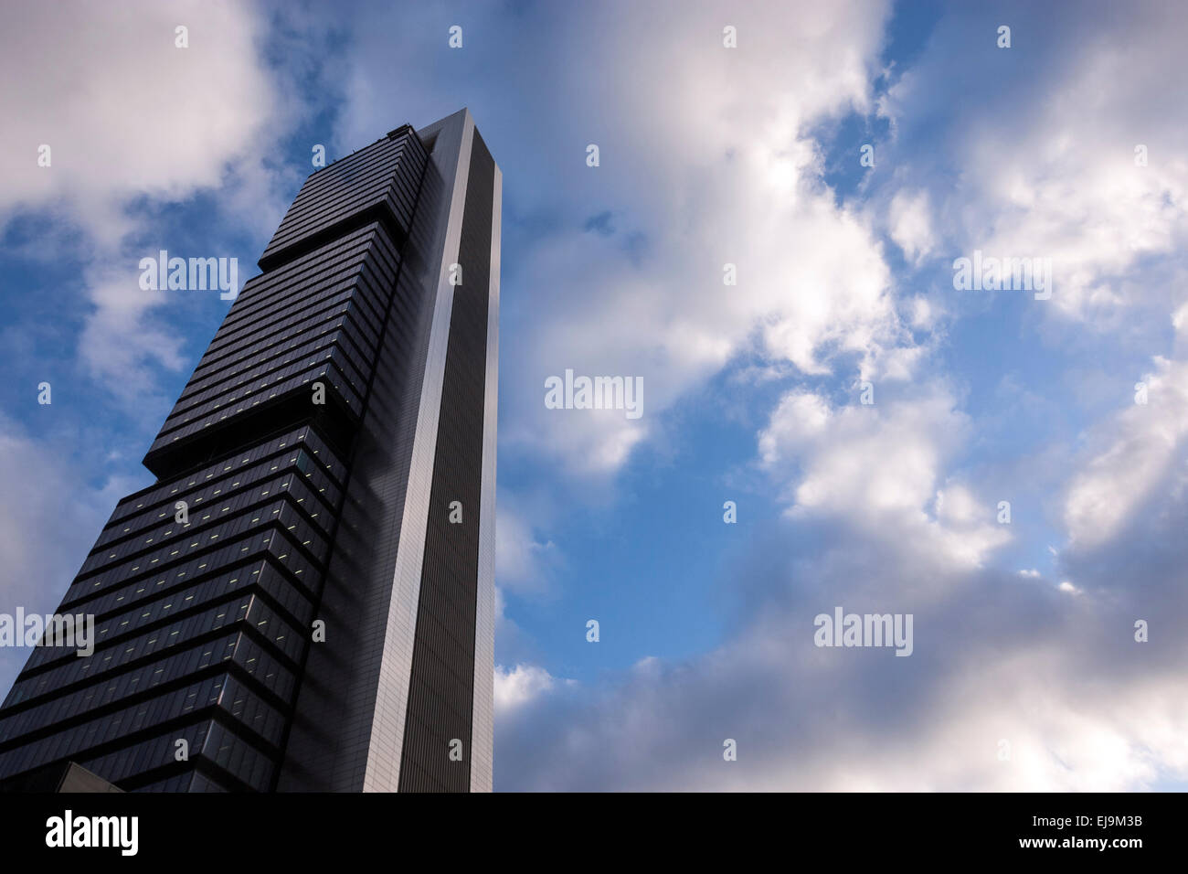 Torre Bankia By Foster, Bankia Tower surrounded by clouds  in Cuatro Torres Business Area, a business district  in Madrid Stock Photo
