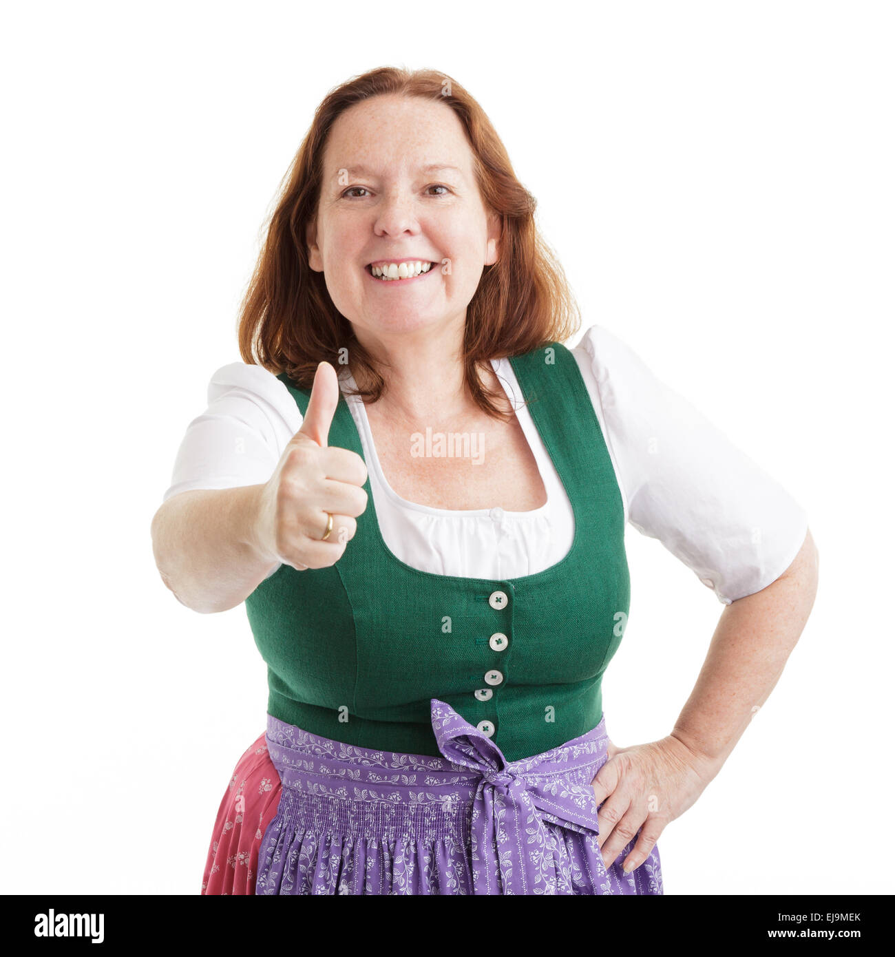 Pensioner woman pointing with thumbs up Stock Photo