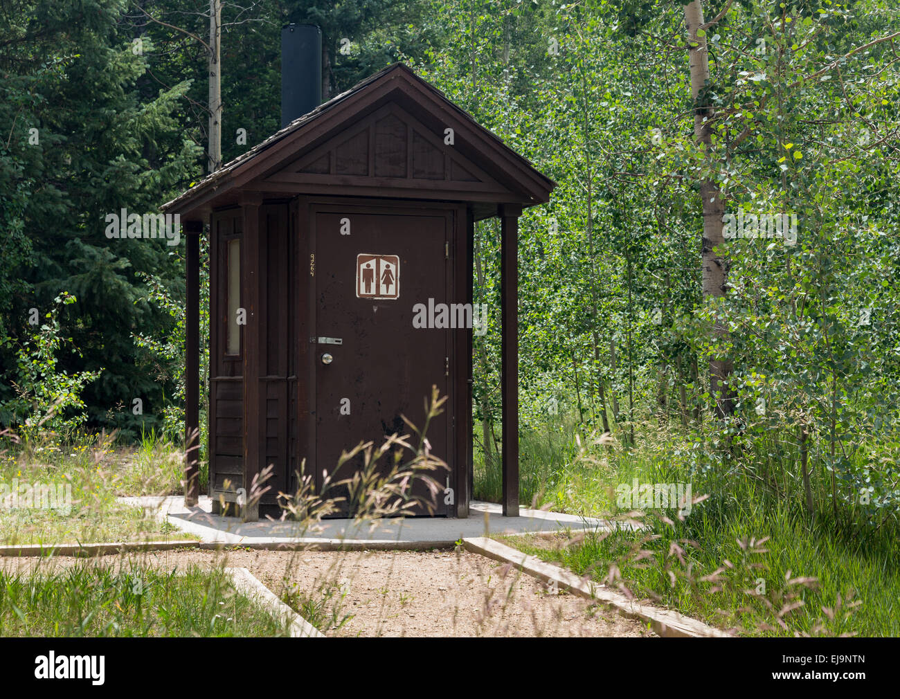 Wooden restroom in forest Stock Photo