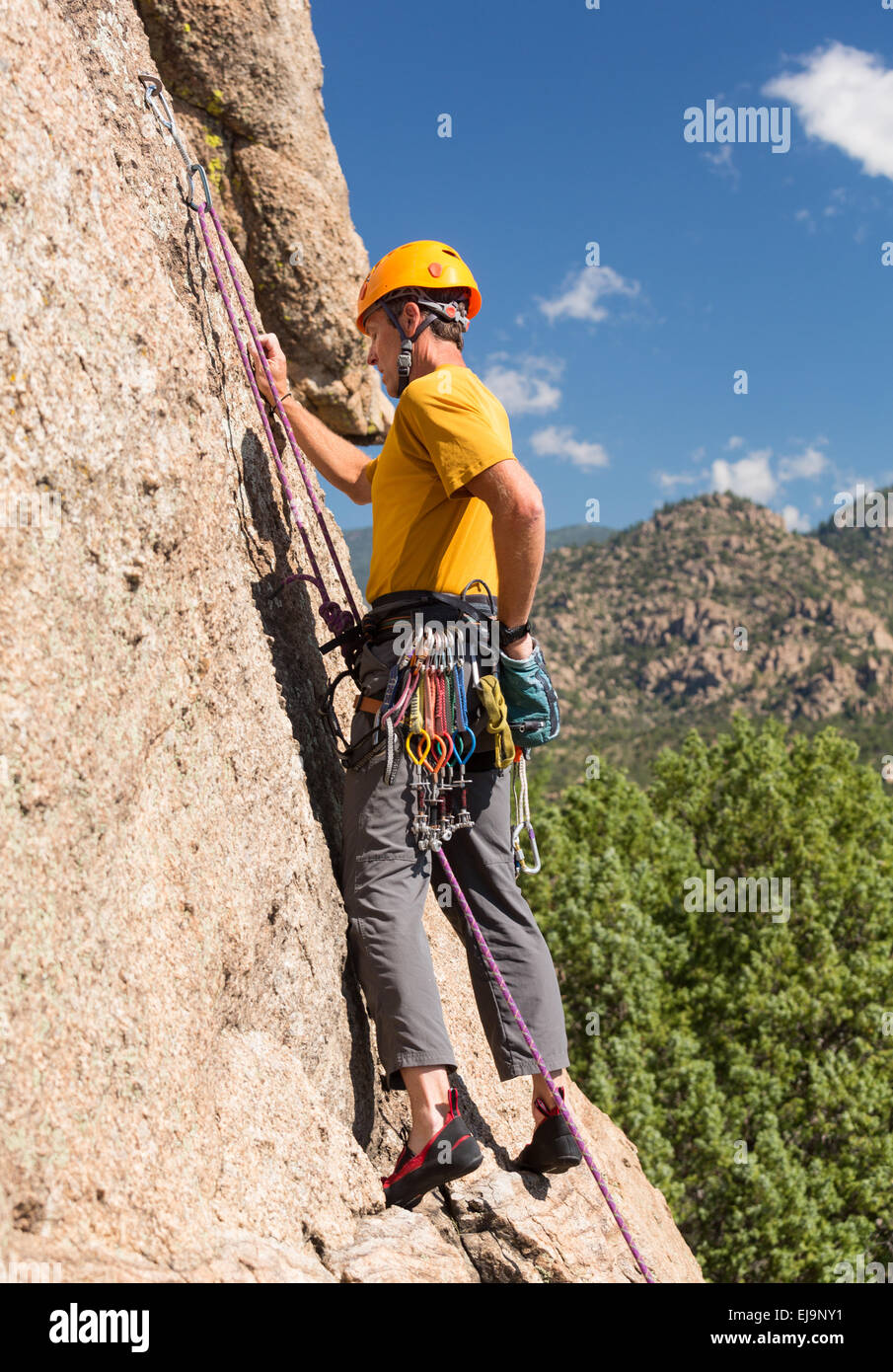 Senior man starting rock climb in Colorado Stock Photo