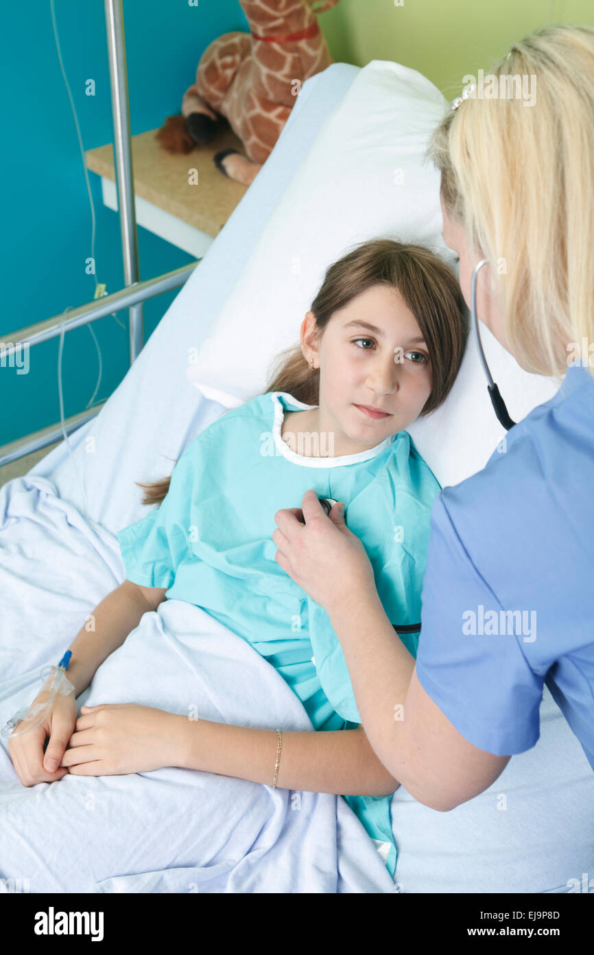 Little girl in hospital bed with the nurse Stock Photo Alamy