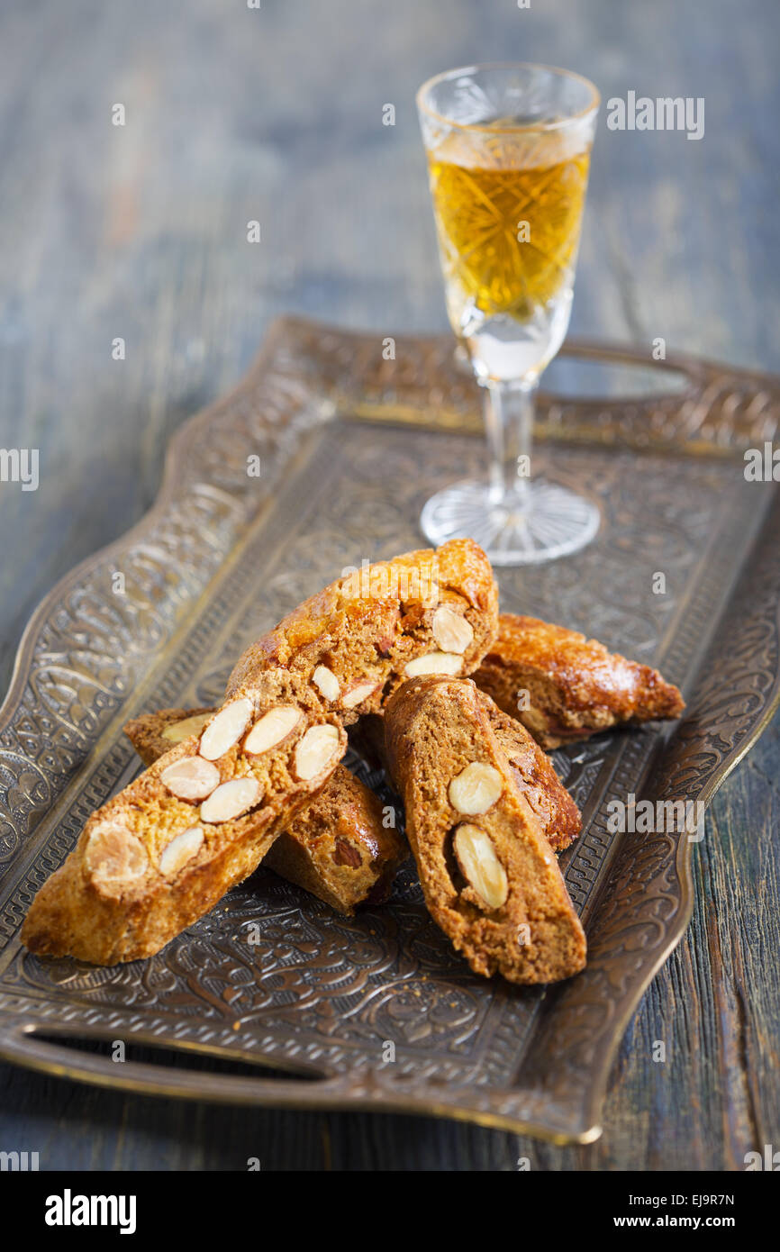 Biscotti and a glass of liquor. Stock Photo