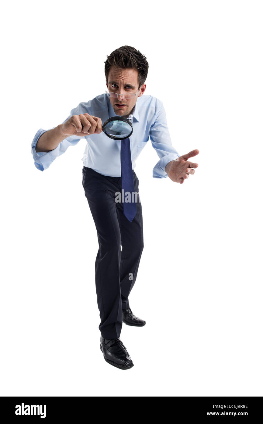 Man with magnifying glass in hand Stock Photo