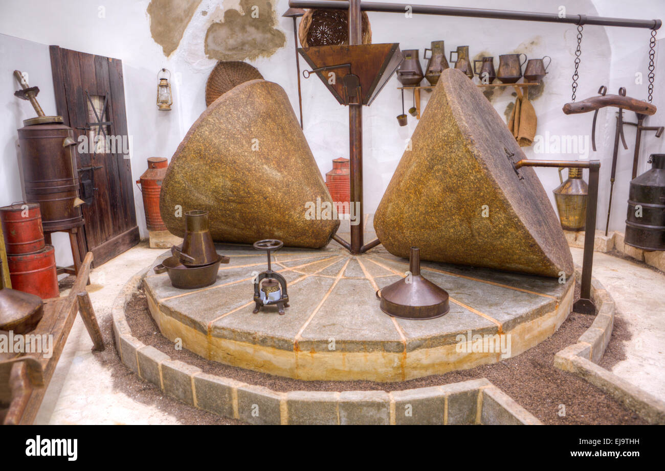 Ancient olive oil production machinery, stone mill and mechanical press, Badajoz, Spain Stock Photo
