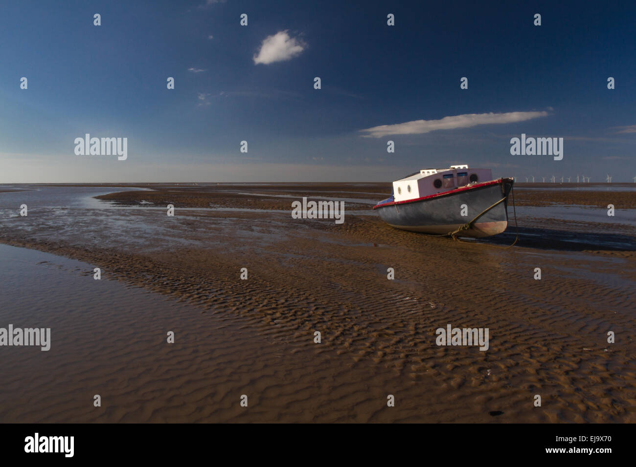 Boat on the shore at low tide, Meols, Wirral Stock Photo Alamy