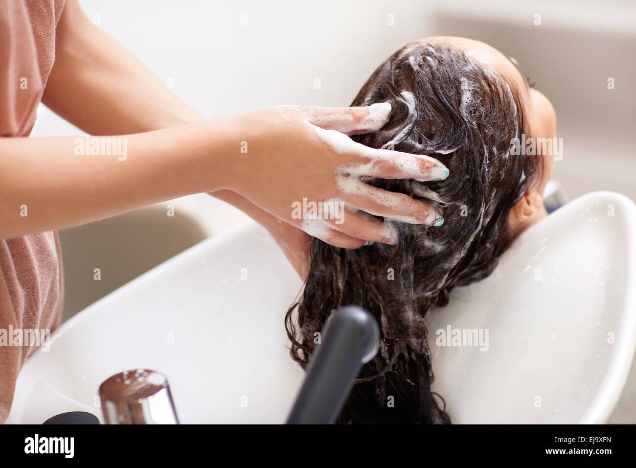 Washing hair Stock Photo