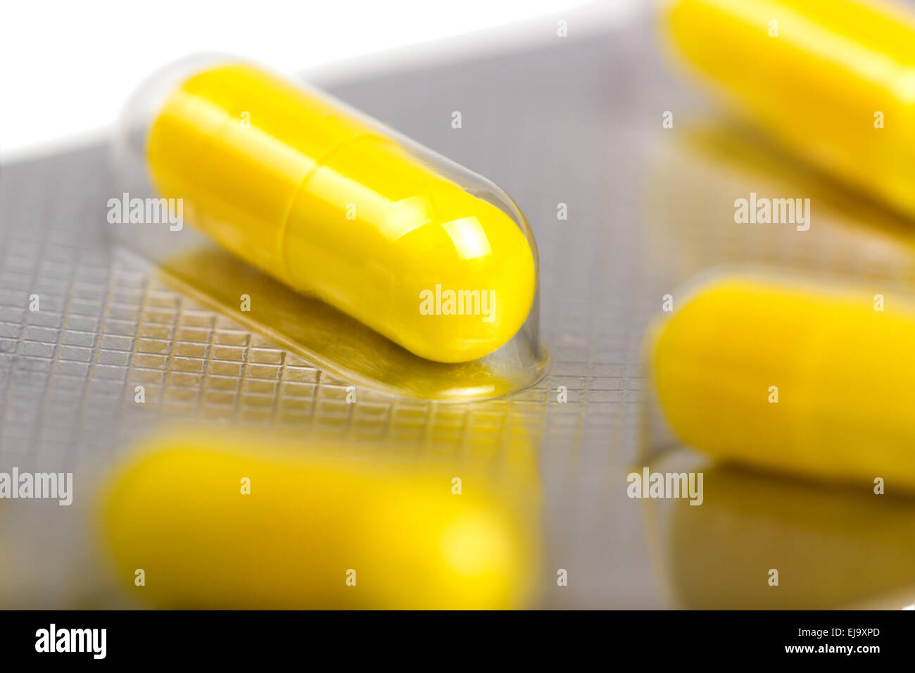 Capsules packed in blisters, isolated on white Stock Photo - Alamy