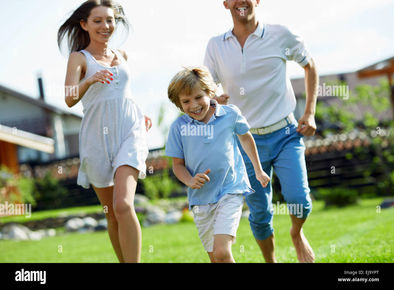 Family running house hi-res stock photography and images - Alamy