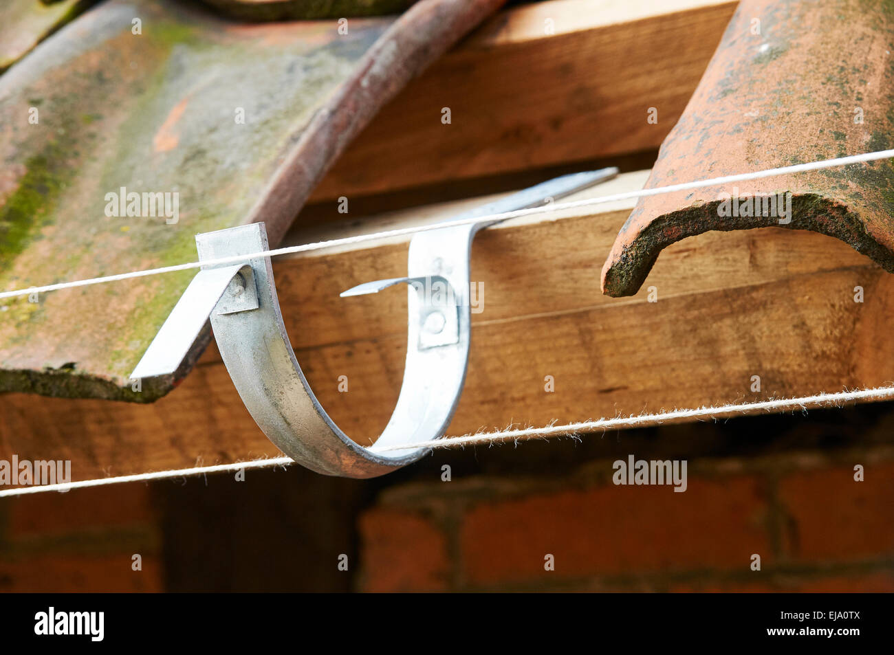 Aligned rain gutter hanger Stock Photo Alamy