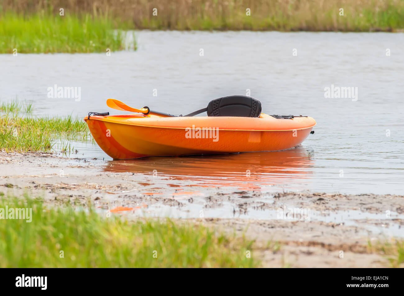 orange kayak on pamlino sound beach Stock Photo