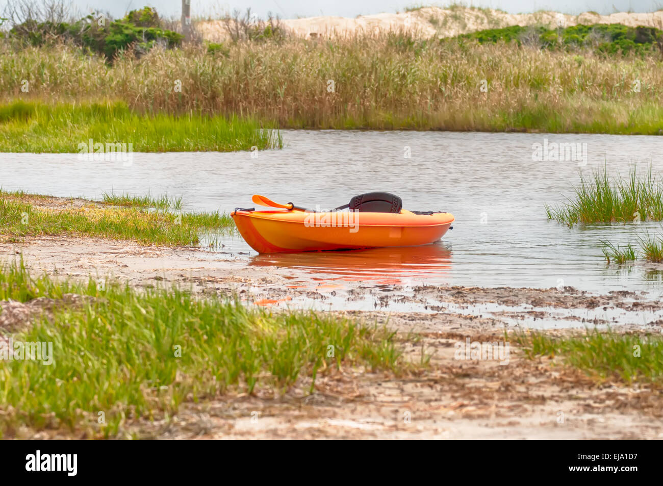 orange kayak on pamlino sound beach Stock Photo Alamy