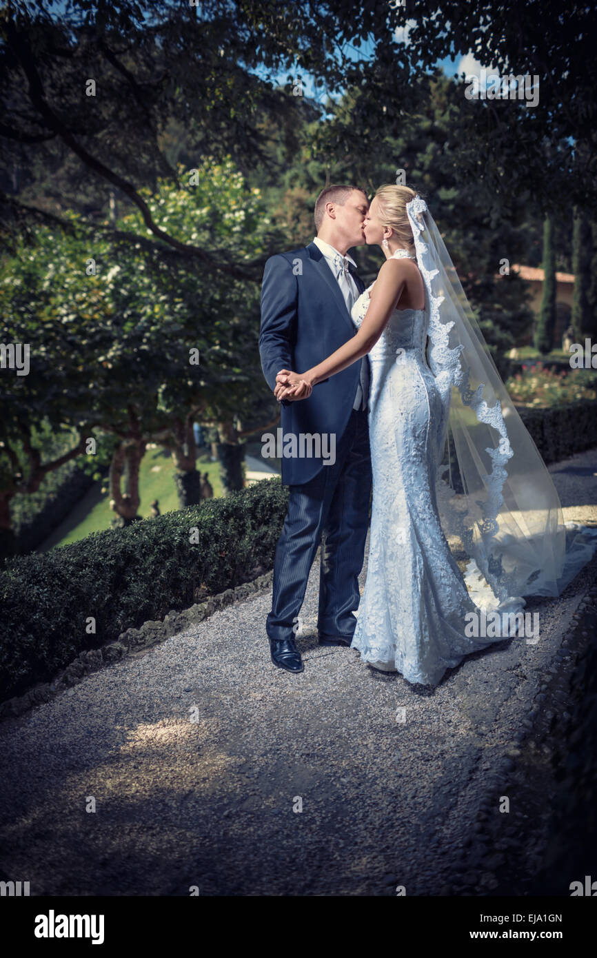 Men kissing the bride hi-res stock photography and images - Alamy
