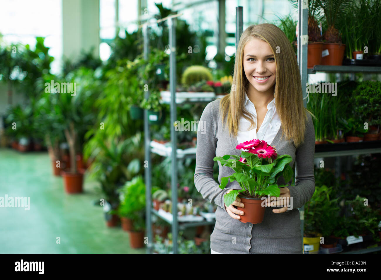 Girl in flower shop Stock Photo - Alamy