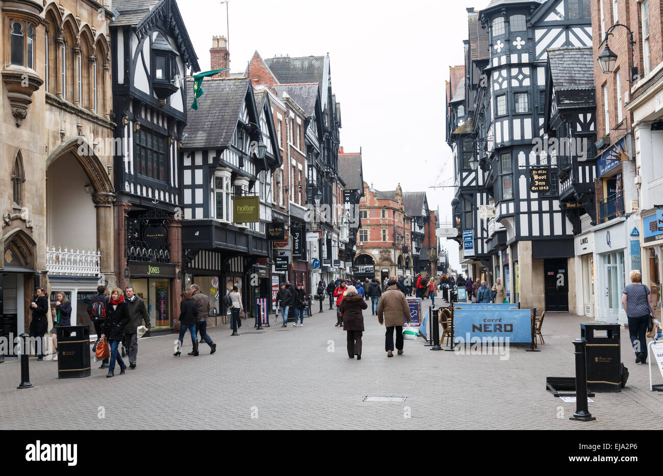 Chester Eastgate Street street scene with shoppers, pavement cafe and half-timbered shops Stock Photo