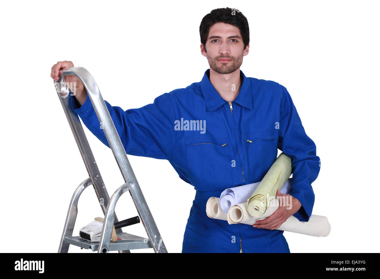 Decorator with step-ladder about to hang wallpaper Stock Photo