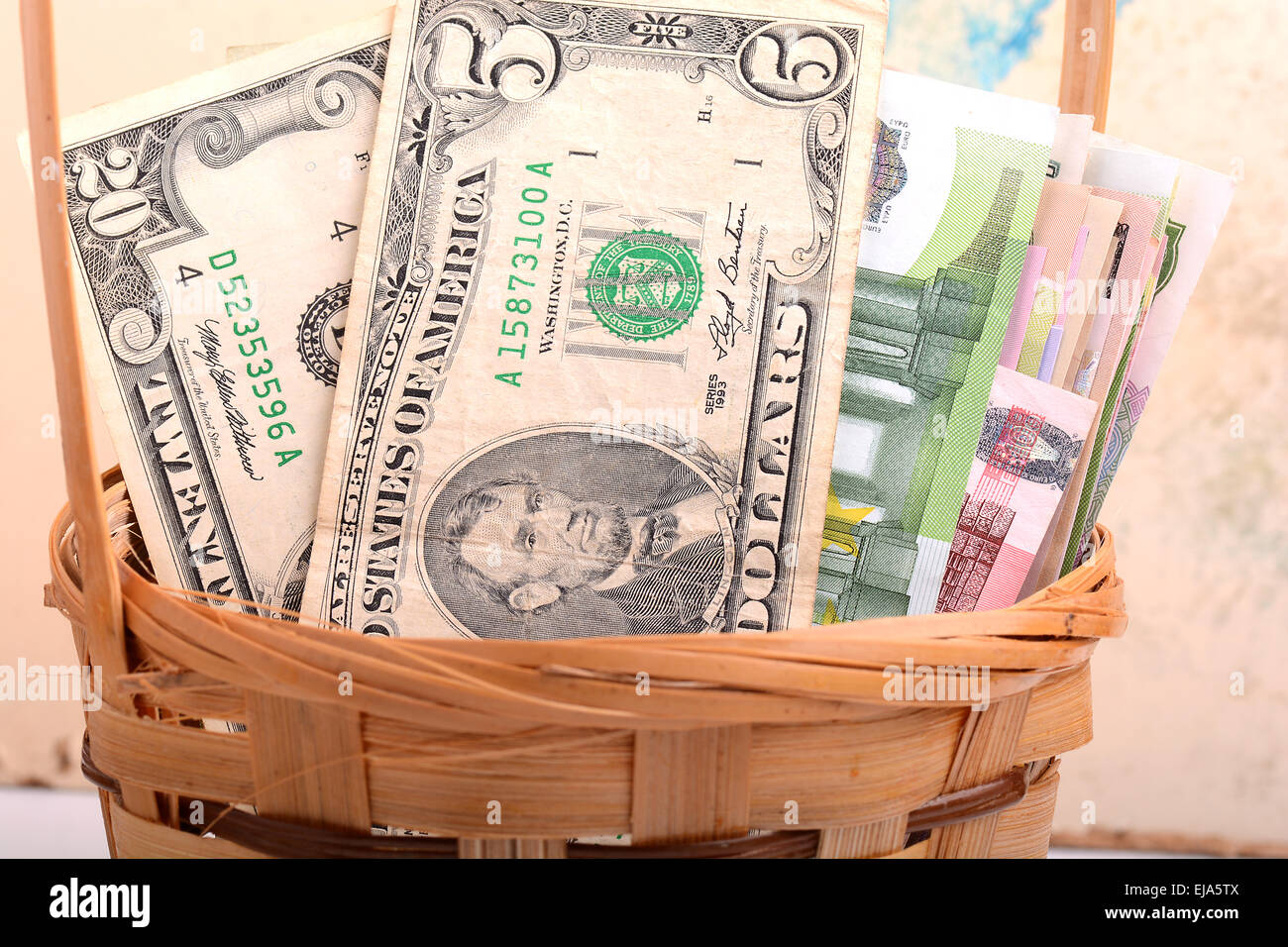 money set in a basket, dollars, euro and ukrainian money Stock Photo