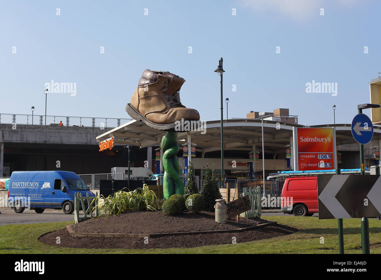 A sculpture showing a boot and a beanstalk located on a roundabout near the Sainsburys Union Street store Stock Photo