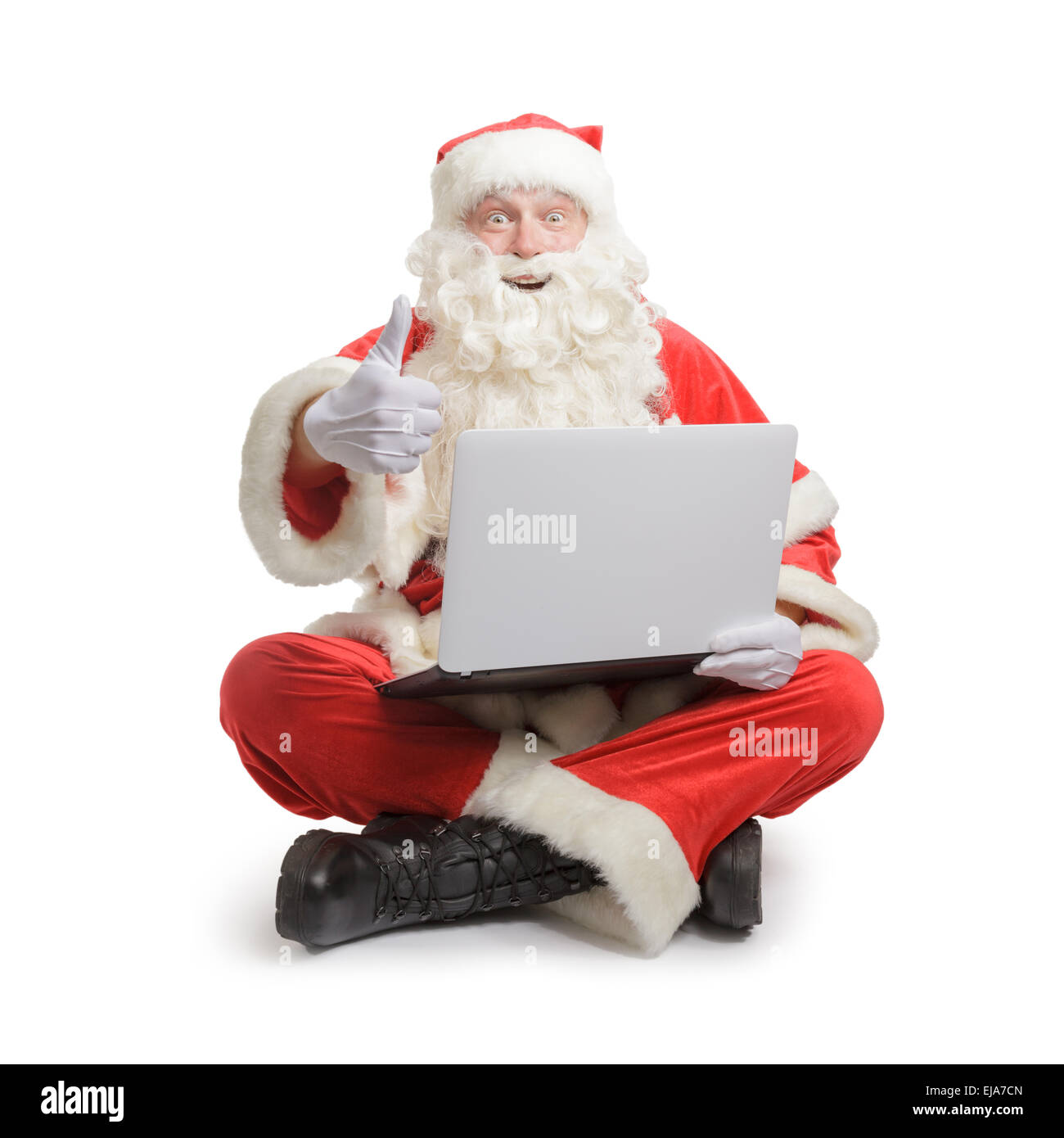 Santa searching for presents in the www Stock Photo