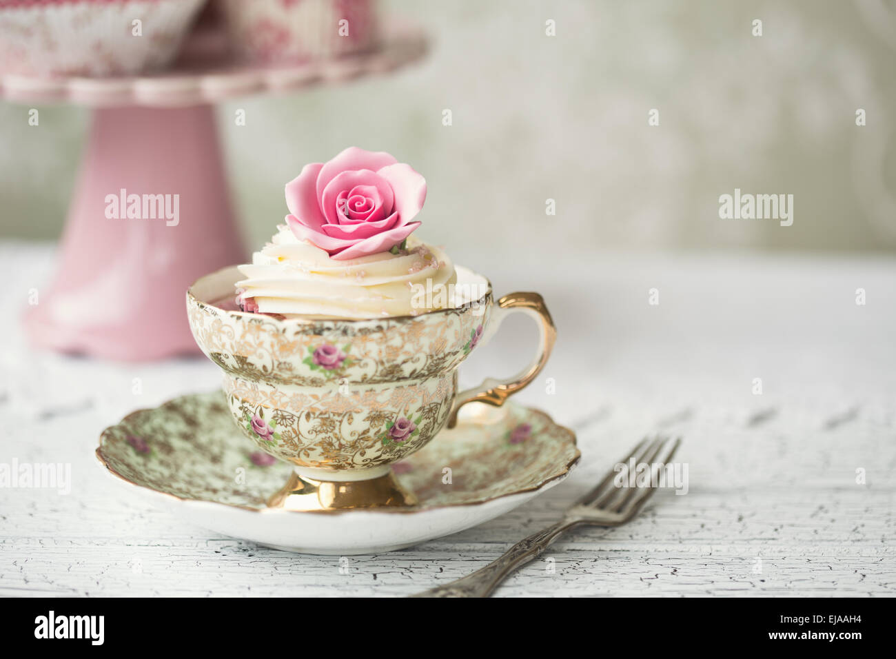 Rose cupcake in a vintage teacup Stock Photo