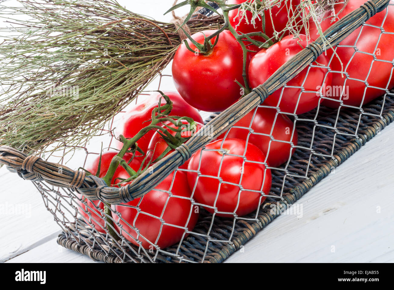 tomatoes in the basket Stock Photo - Alamy