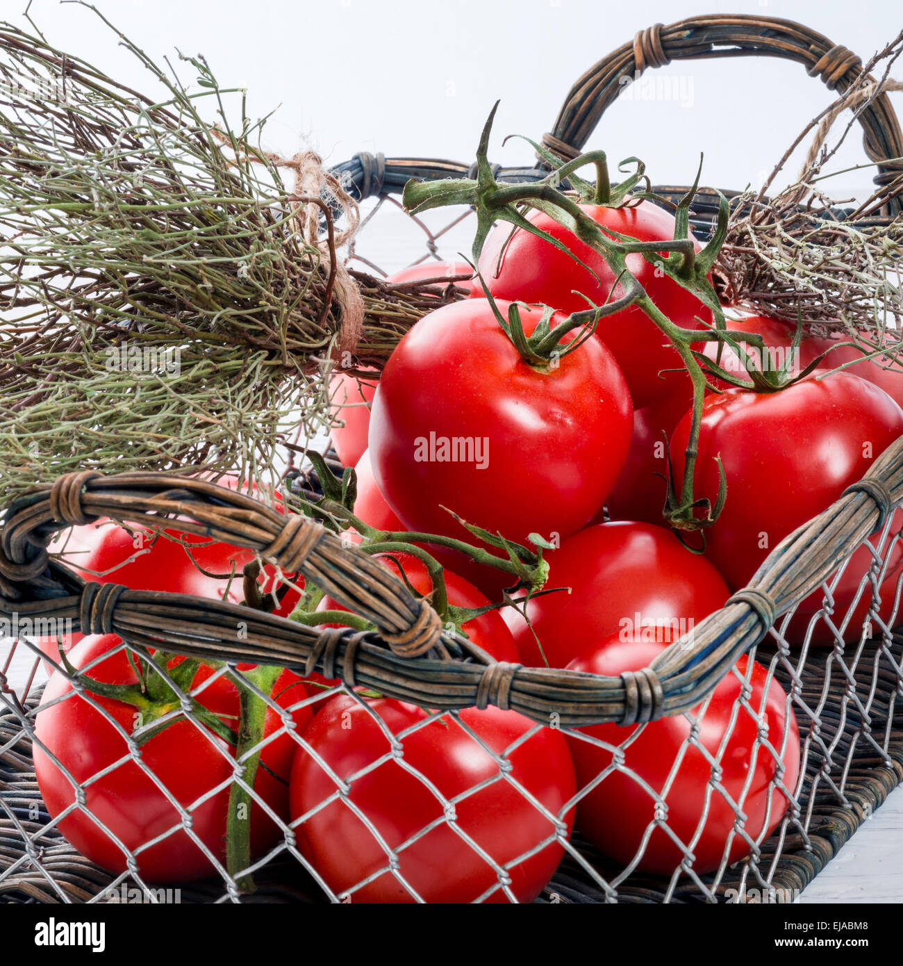 tomatoes in the basket Stock Photo - Alamy