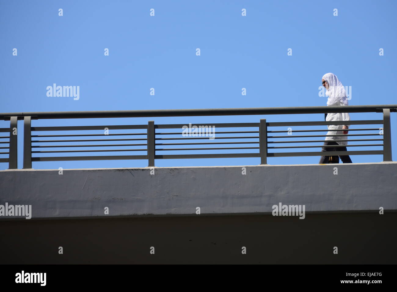 woman walking in a bridge Stock Photo - Alamy