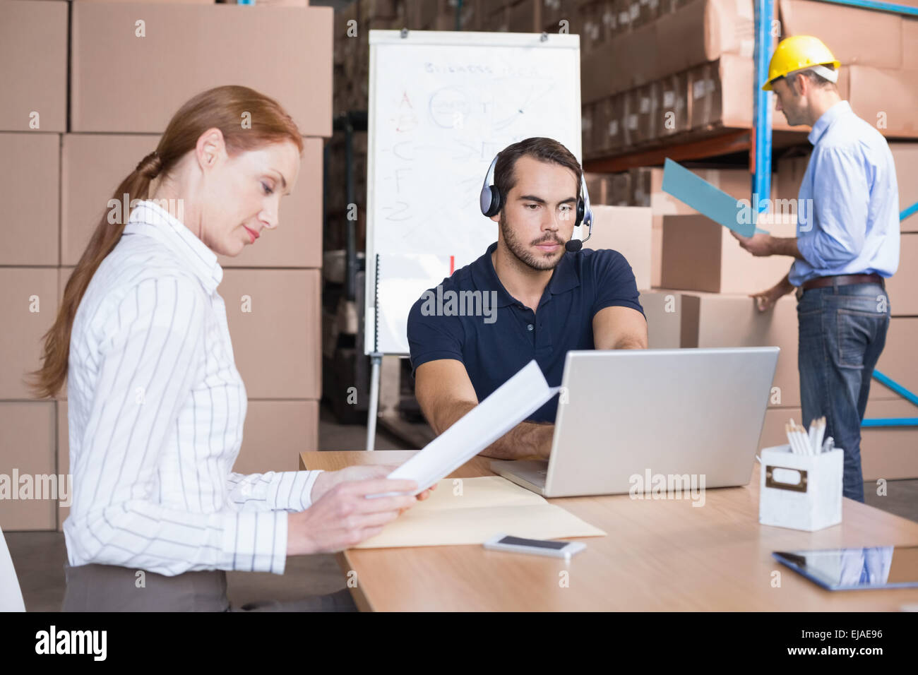 Warehouse team working together on shipment Stock Photo - Alamy