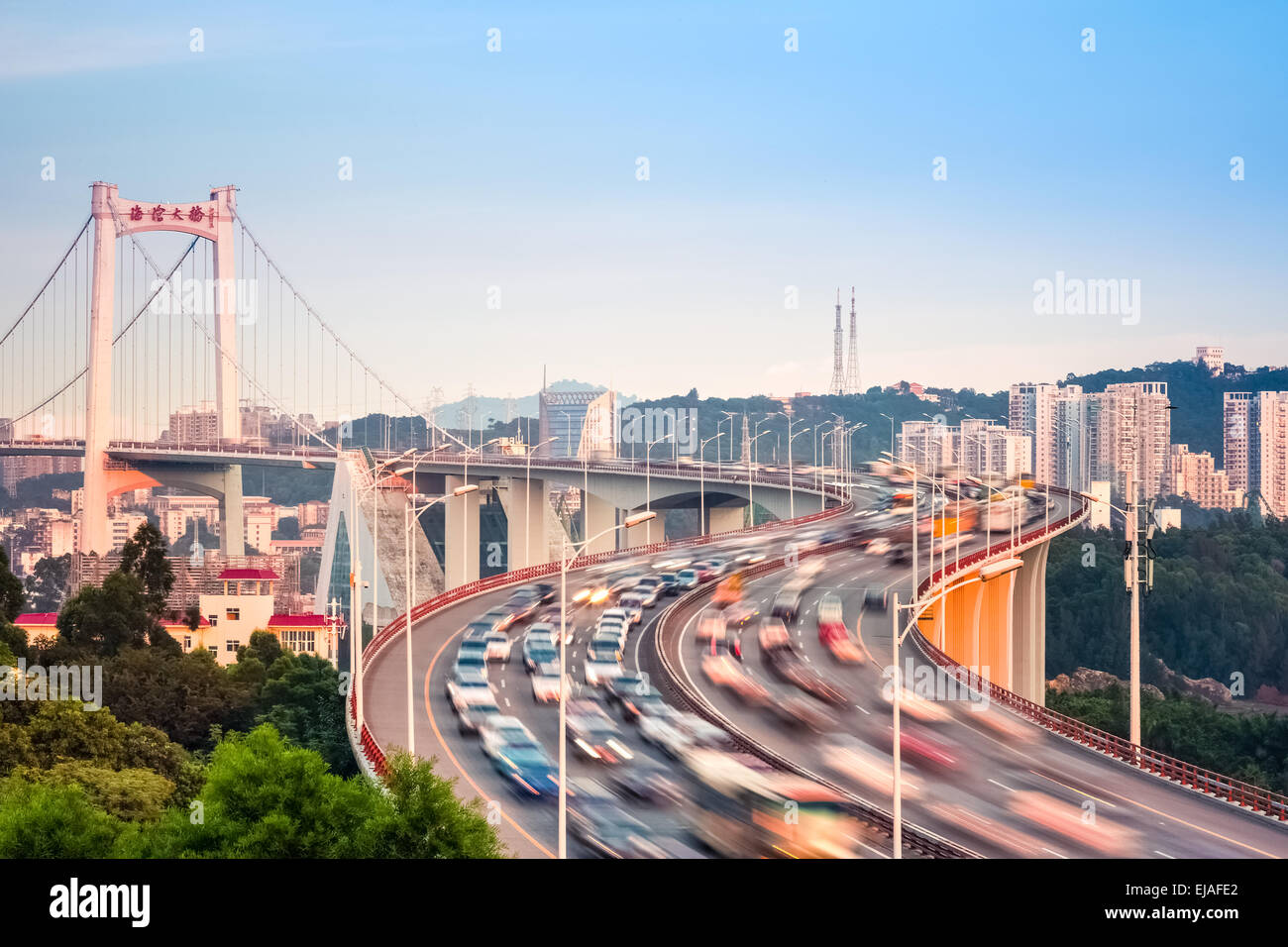 graceful suspension bridge in sunset Stock Photo