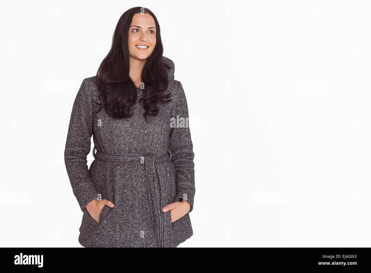 Woman with hands in pockets Stock Photo - Alamy