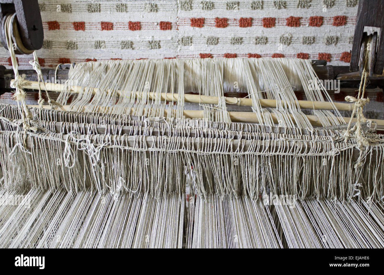 Weaver with wire to make looms, sewing and manufacturing Stock Photo