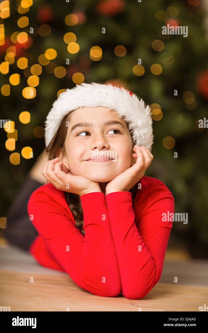 Festive little girl lying on floor Stock Photo Alamy